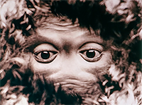 face and hair looking upside down merged together with dark eyes